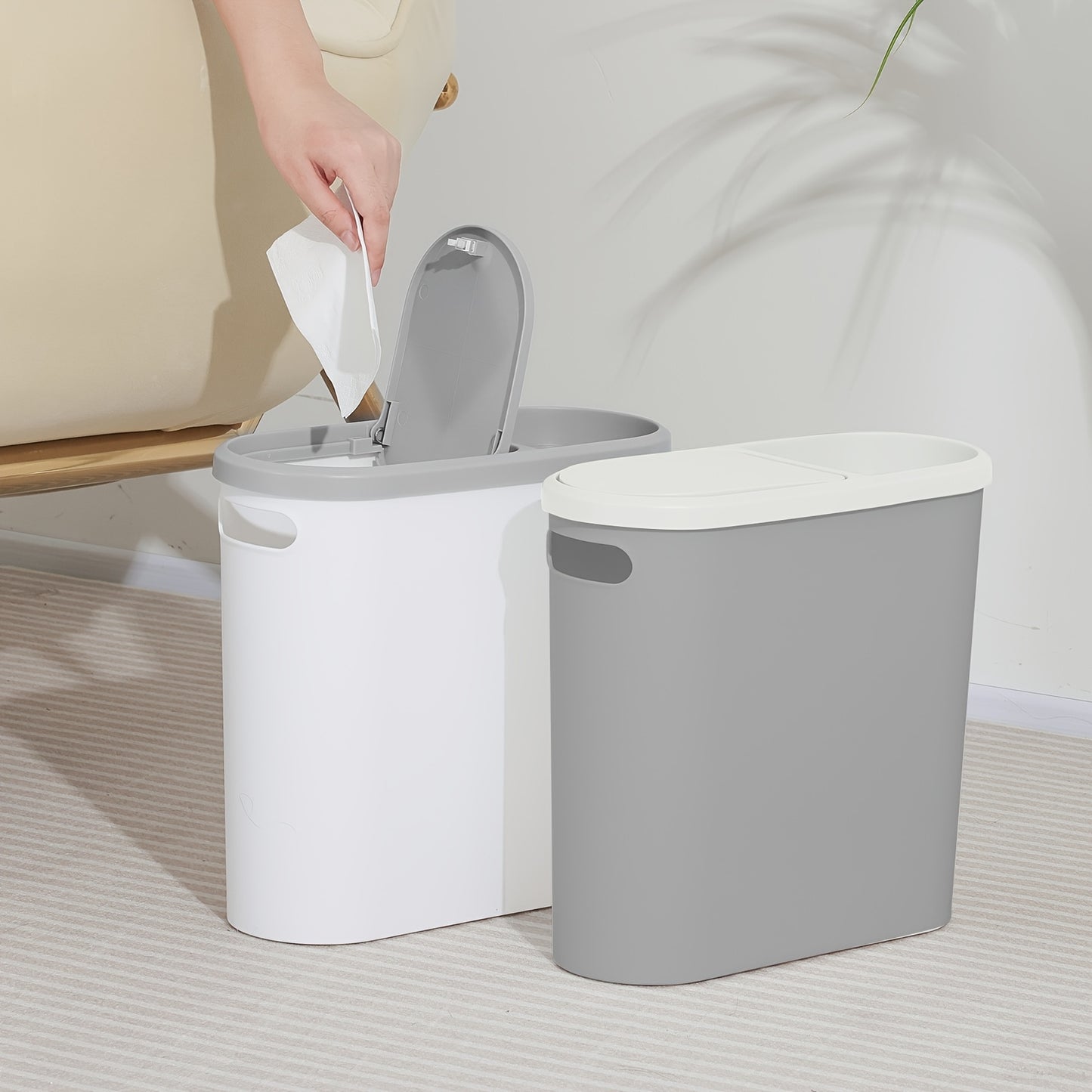 Durable plastic trash can with built-in handle for small spaces such as bathrooms, laundry rooms, and home offices.