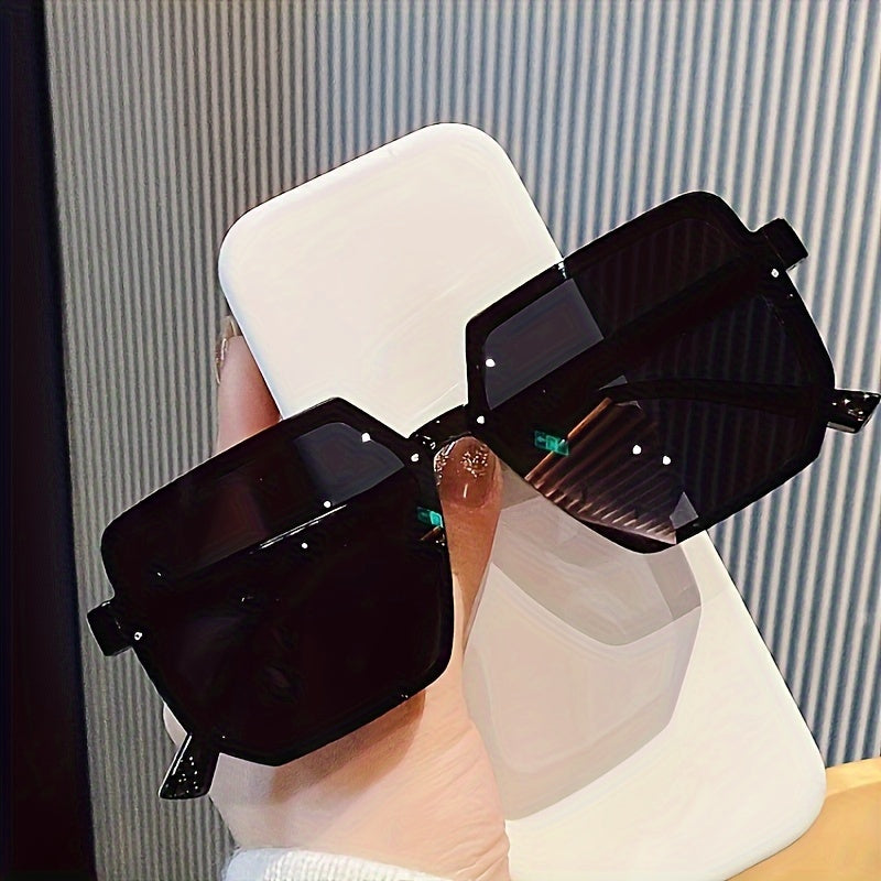 Large square plastic sunglasses for outdoor activities.