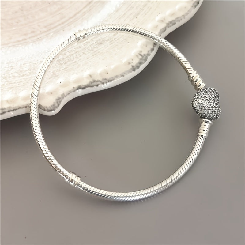 Pair of romantic couple bracelets with double-sided love zirconia lock clasps in a smooth snake pattern design, perfect for wearing to daily parties. Can be paired with a beaded pendant for a matching jewelry set, making it a great gift idea.