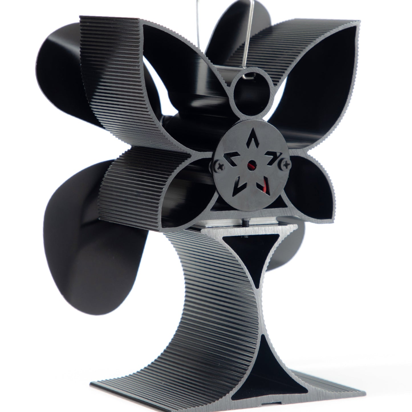 One or two pieces of a four-blade wood stove fan, designed for distributing heat from wood, gas, or log burner stoves. This heat-driven wall fan is a cozy home heating accessory for autumn and winter. It does not require electricity and includes a