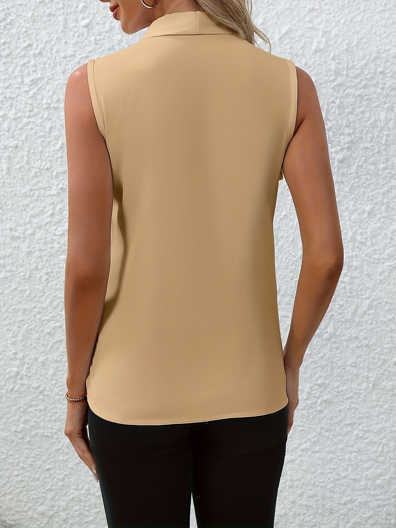 Lightweight, elegant yellow V-neck sleeveless blouse for women. Chic solid color, made of polyester, easy to machine wash. Perfect for spring/summer fashion.