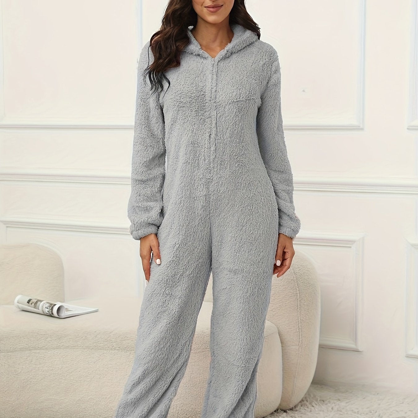 Hooded lounge jumpsuit with fuzzy fabric, zippered front, perfect for women's loungewear and sleepwear.