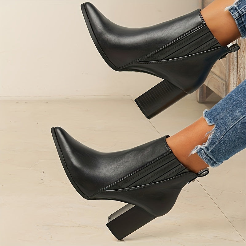 Trendy slip-on ankle boots in solid colors with chunky heels and a pointed toe.