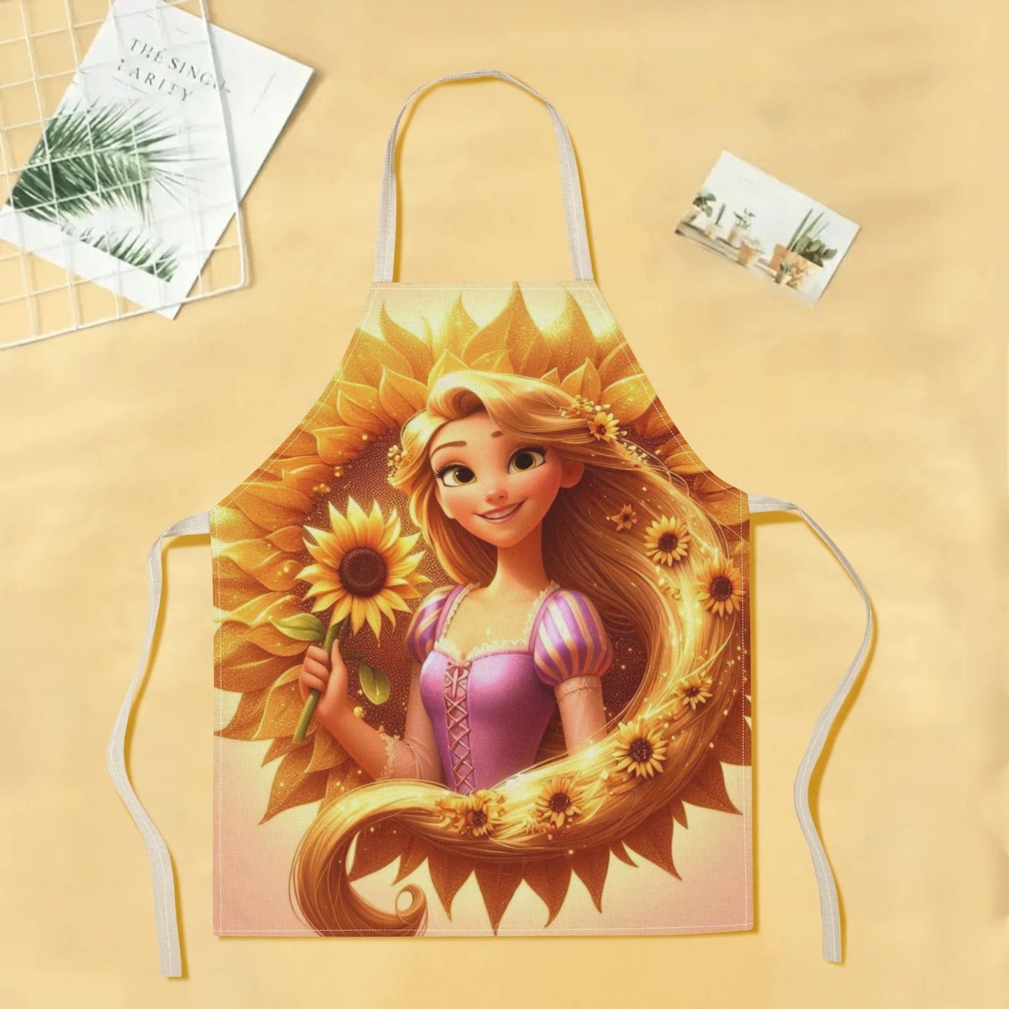 Waterproof Disney Elsa apron featuring a vibrant cartoon princess design with sunflowers. Perfect for use in homes, restaurants, cafes, and supermarkets. Made from durable polyester for easy care and versatility. Glossy finish adds a polished touch to