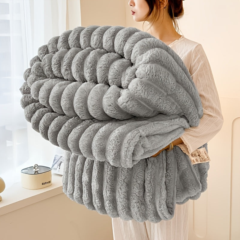 Get cozy with this multifunctional blanket made of ultra-soft milk fleece. Featuring a modern striped texture, this blanket is perfect for all-season comfort on your bed, sofa, or even while camping. Machine washable for easy care, this blanket is an