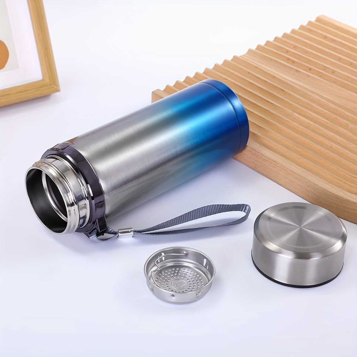 Men's large stainless steel portable travel mug with tea strainer, available for wholesale.