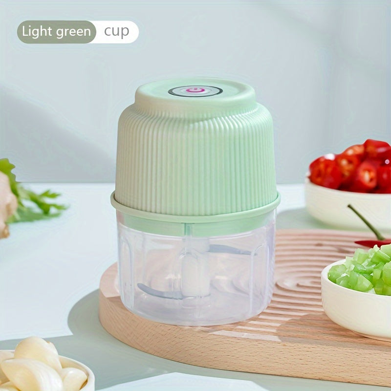 Portable electric garlic mincer with stainless steel blades; also functions as a chili crusher and food processor. Features USB charging, 500mAh lithium battery, and anti-splash design.