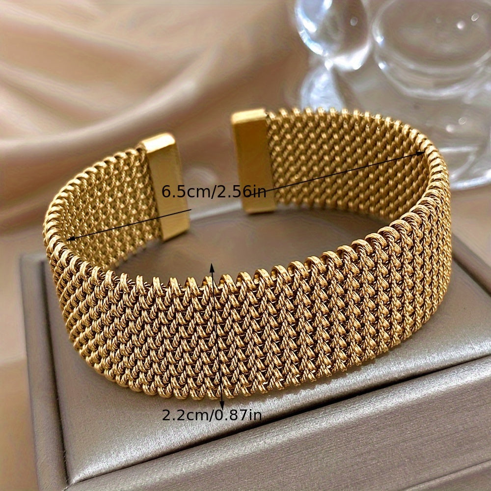 Stylish woven stainless steel bracelet with a golden touch, versatile accessory in trendy golden tone.