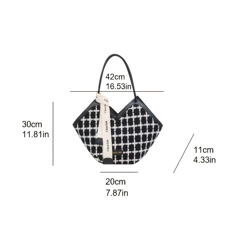 Stylish black plaid tote bag for women, spacious with zip closure and matching strap.