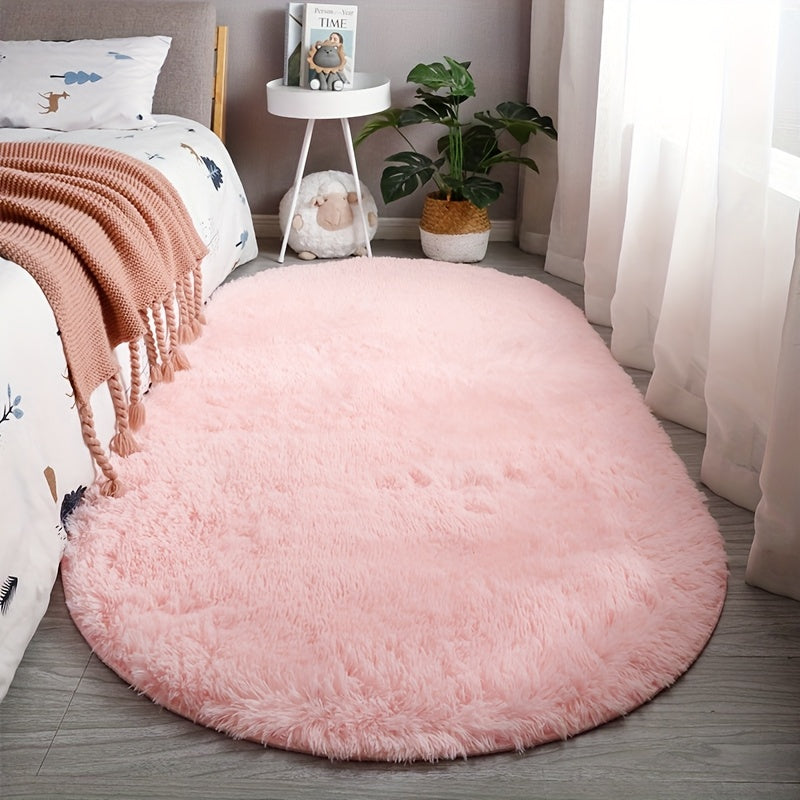 Soft faux fur oval area mat that is luxurious, plush, non-slip, hand washable, and durable. Perfect for adding a touch of elegance to your bedroom, living room, or home decor. Available in two sizes.