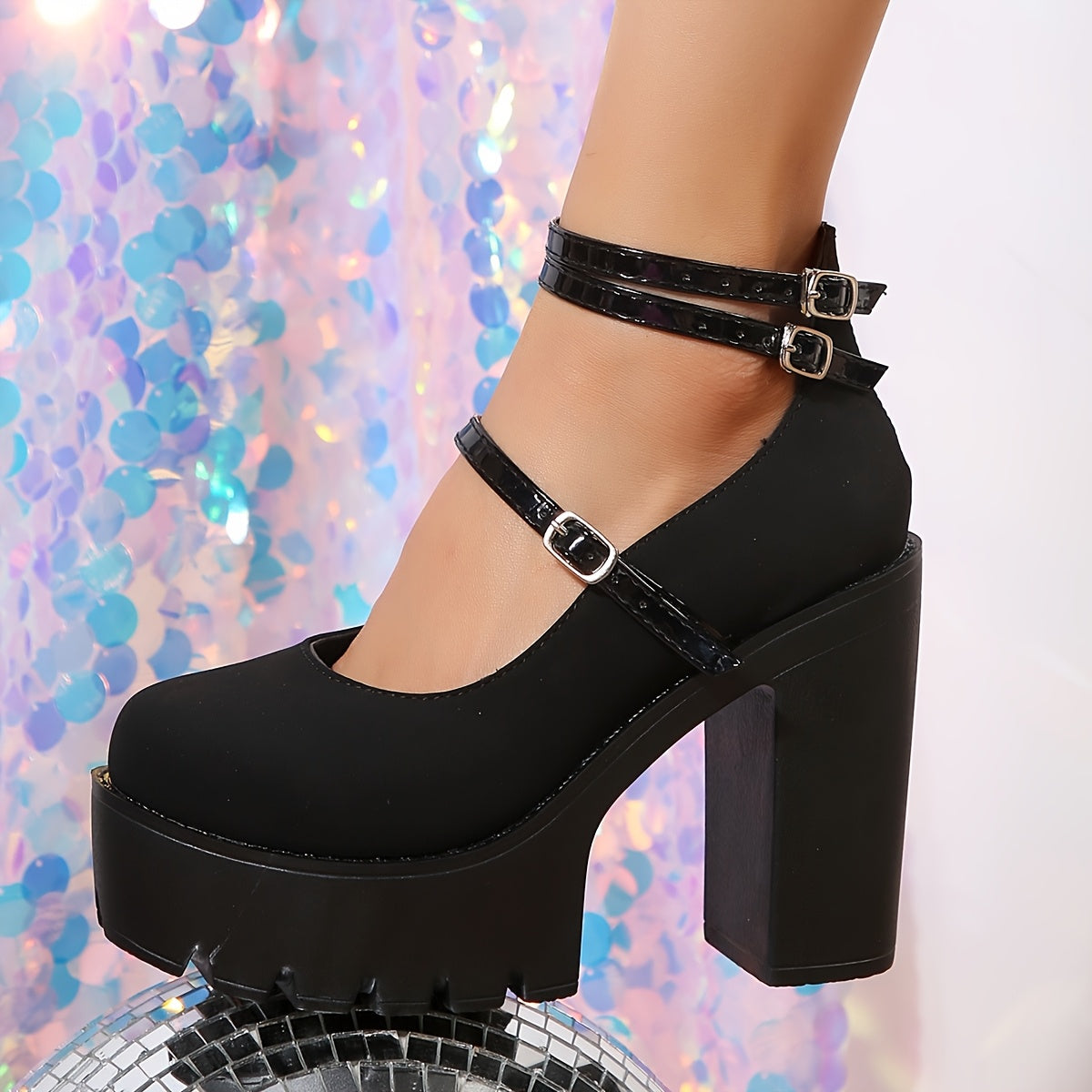 Black pumps with ankle strap, block heel, and fabric lining for all-season comfort by Huizhou.