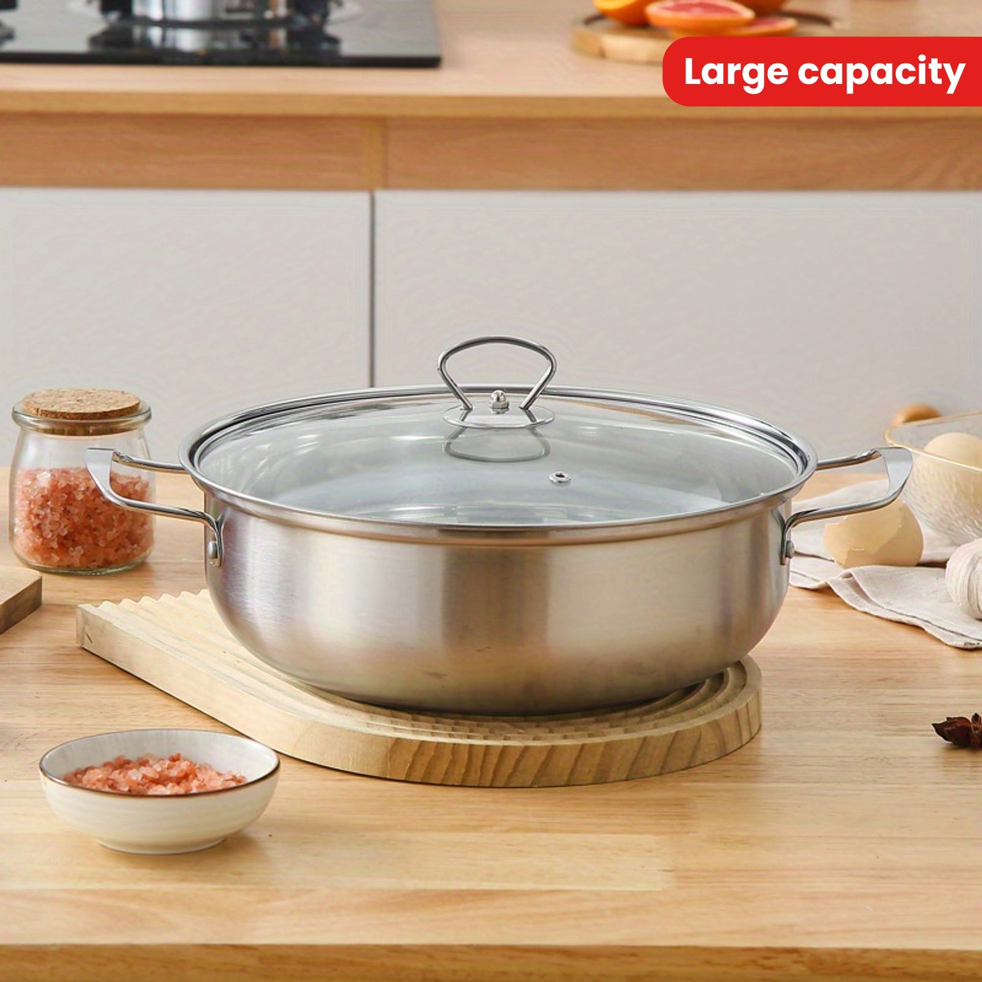 Large capacity stainless steel hot pot with lid, perfect for home and commercial use. This induction-compatible cookware set is ideal for making clear soup. The magnetic base allows for use on induction stovetops without the need for a power supply.