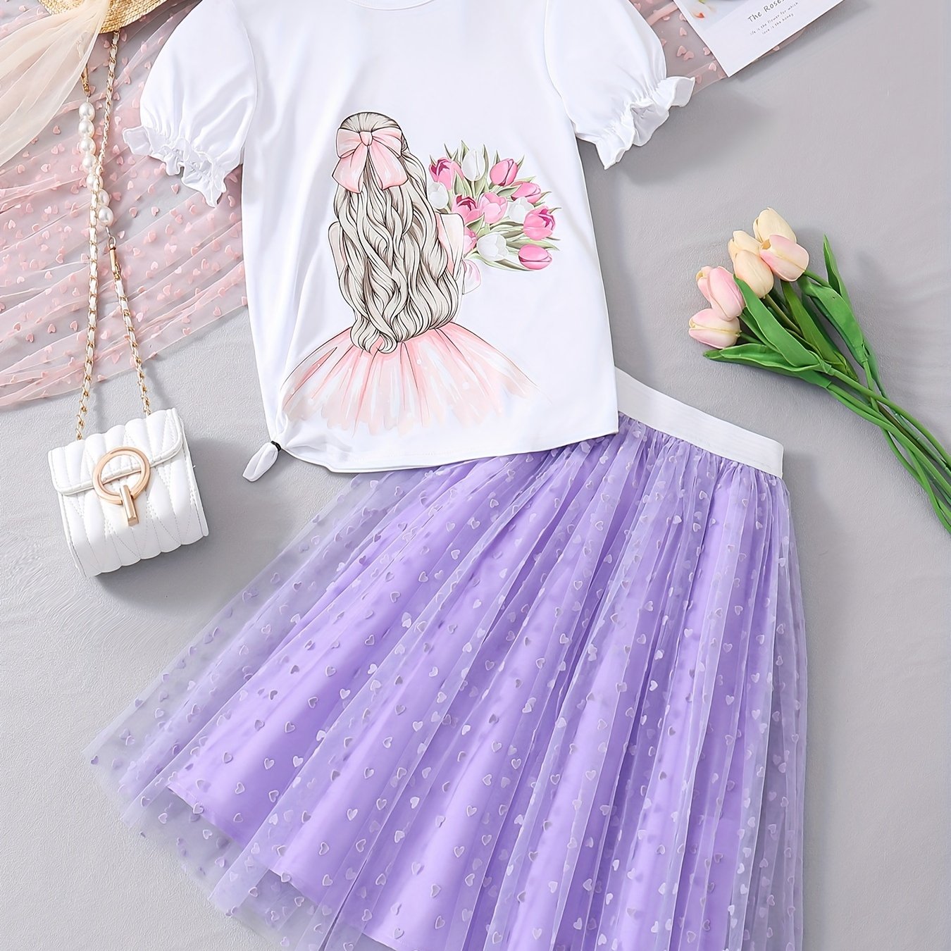 2-piece set featuring a cartoon graphic t-shirt and tutu skirt for girls, perfect for summer outdoor parties. Great as a gift.