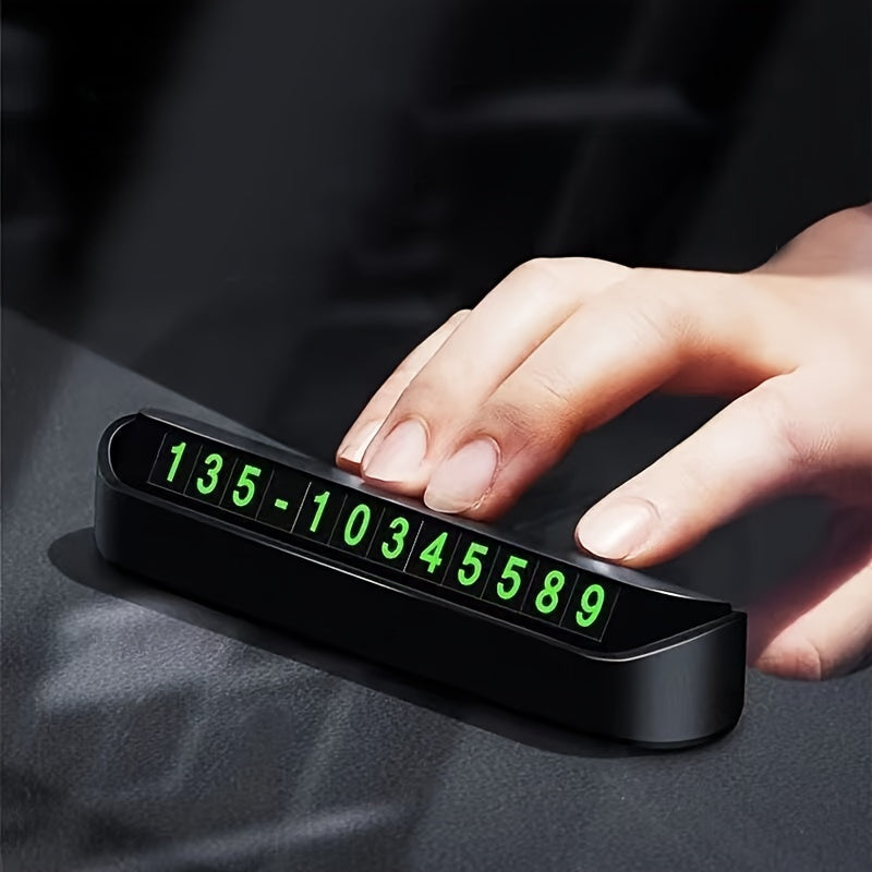 Night-visible, durable plastic dashboard parking number sign for easy contact.