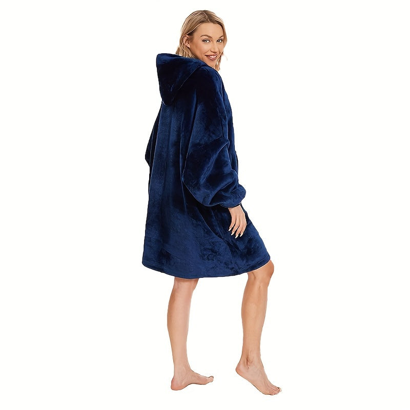 One piece of an oversized hooded blanket made from super soft flannel fabric. This wearable blanket features a stylish hood and a convenient pocket, providing warmth and comfort in cold weather.