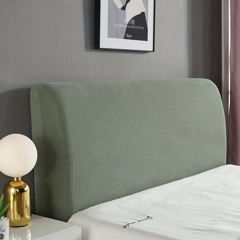 Stretchable dark green headboard cover made of cozy knit fabric that is dustproof and protective. Fits padded headboards measuring 208.28cm-238.76cm. Machine washable with an elegant