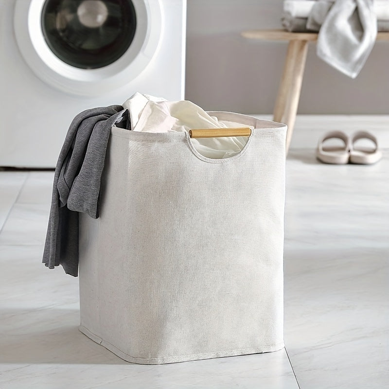 A foldable laundry basket that is perfect for storing dirty clothes, whether it be in the bathroom or in the laundry room. Made of fabric, this portable storage solution is both practical and stylish.