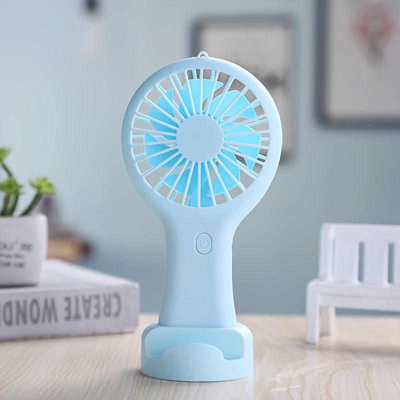 Compact and wearable mini fan for travel, office, outdoor, and home use. This handheld fan is portable, USB rechargeable, and includes a 400mAh lithium battery.