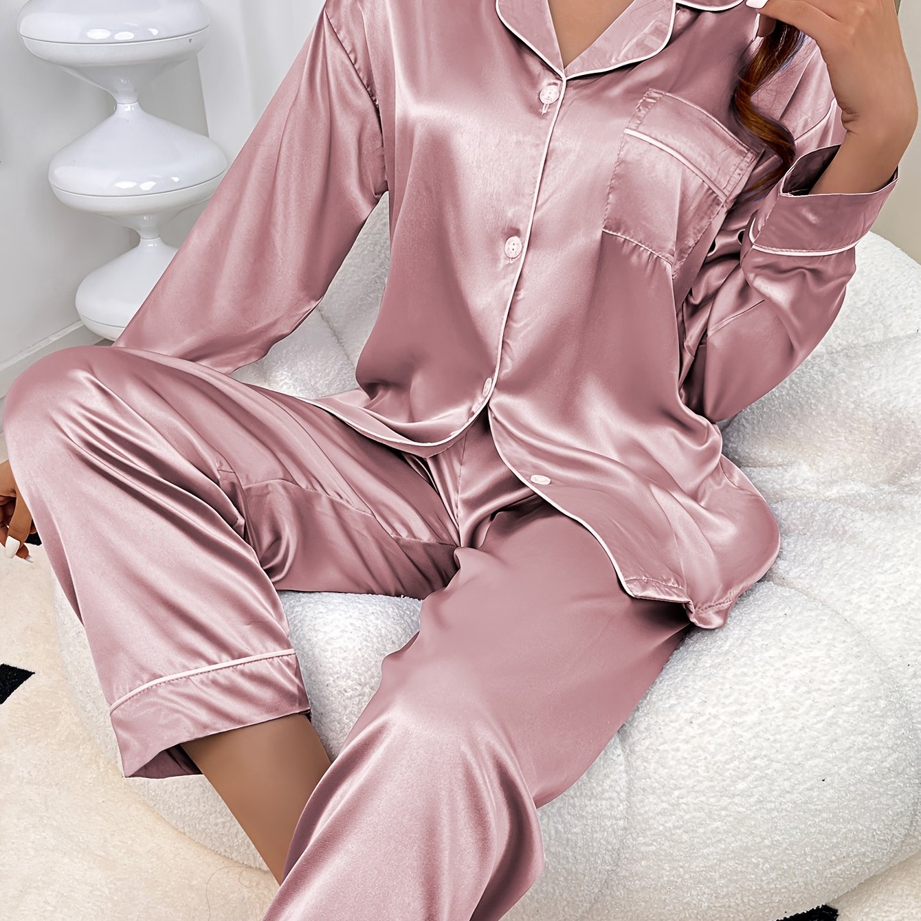 Stylish satin pajama set for women, featuring long sleeve top and pants with lapel collar and button detail. Made of 90% polyester and 10% elastane, perfect for all seasons as solid color