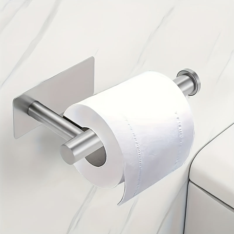 Stainless steel self-adhesive toilet paper holder.