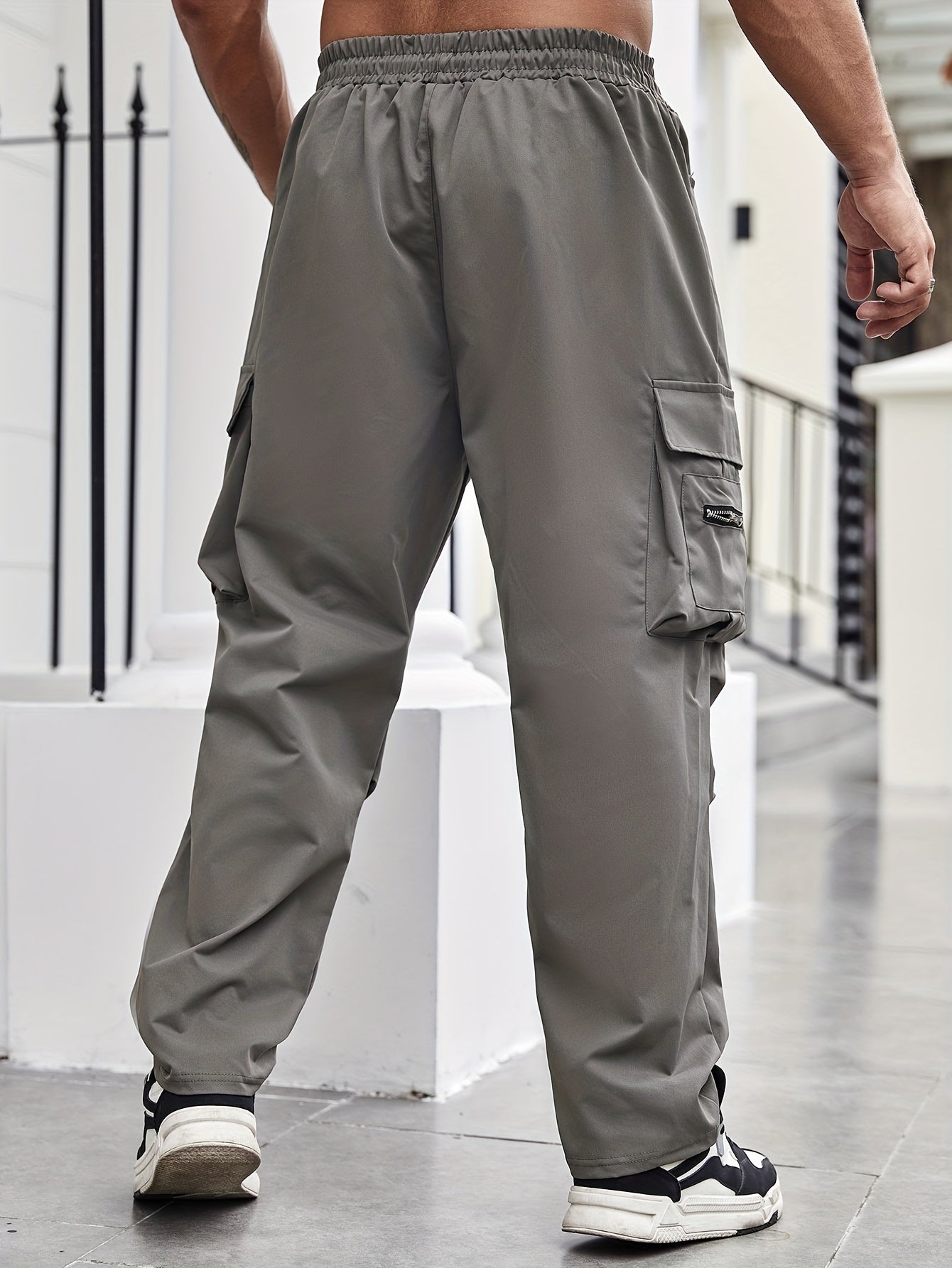 Durable polyester cargo pants for men in plus sizes, suitable for all seasons.