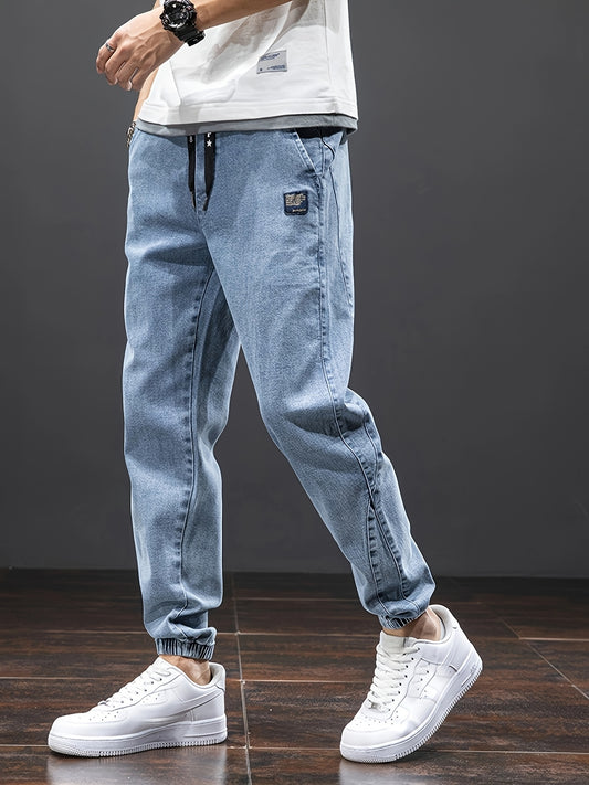 Men's mid-rise cropped jeans with elastic waistband made of 70.7% blend, solid color washed denim, regular fit for all-season wear.