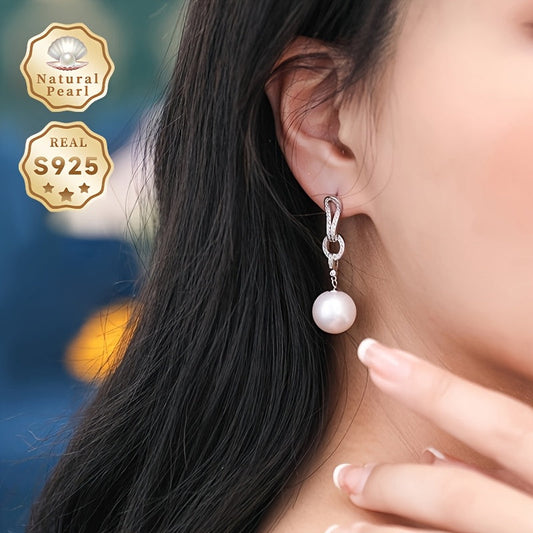 Add a touch of elegance to your collection with these must-have Pearl Dangling Earrings. Crafted with 13-14mm round natural freshwater pearls, these fashionable long earrings are made of S925 silver. Each pair is unique and features varying shapes and