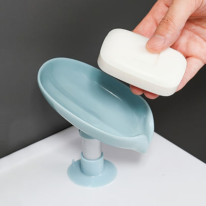 Suction cup soap dish with drainage for home organization and storage, suitable for kitchen and bathroom use.