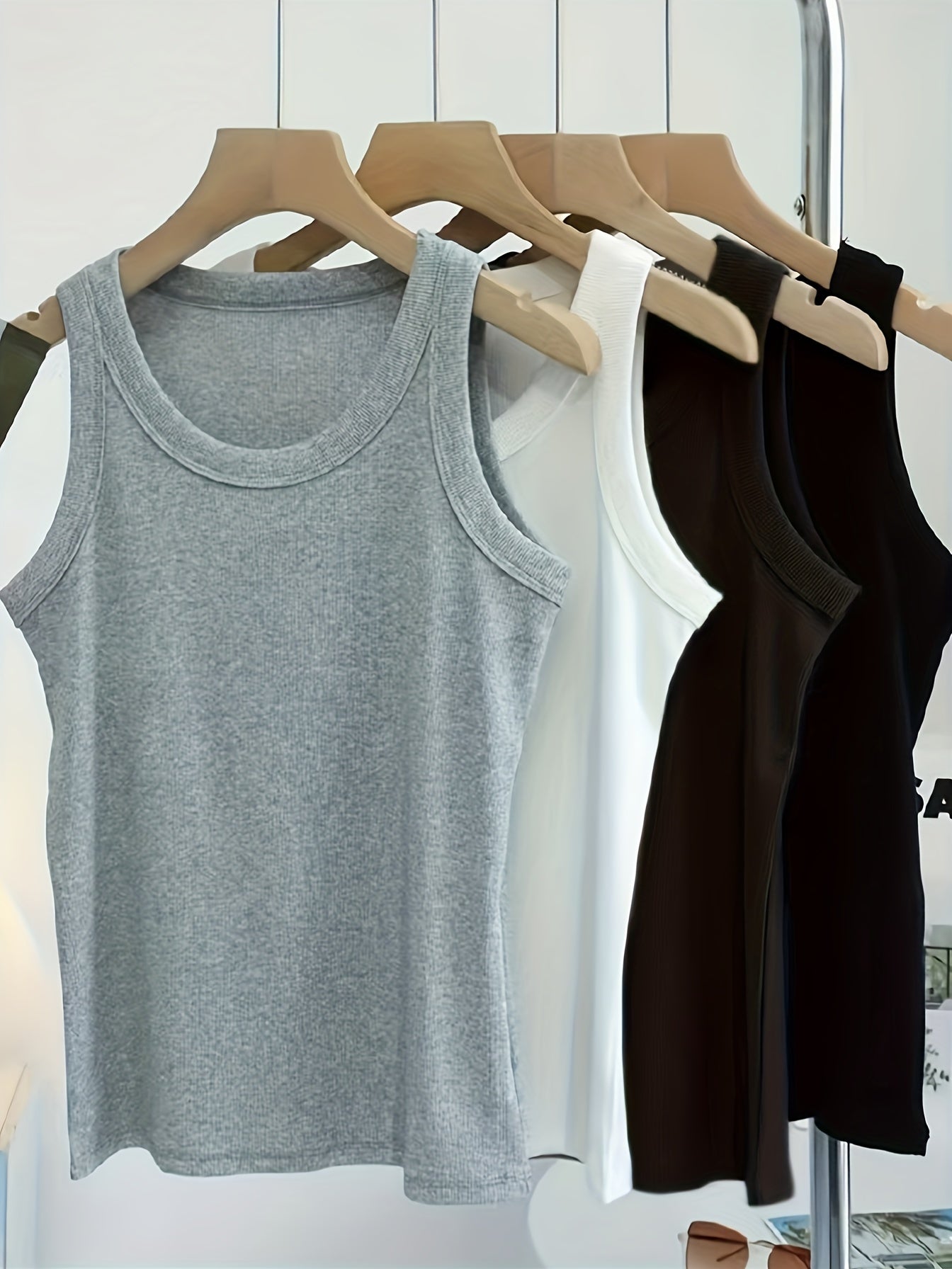 Set of 4 U-neck camisole vests for women, perfect for spring/summer. Can be worn as an outer layer or as a sleeveless base shirt. Features low neckline for breathability and comfort.