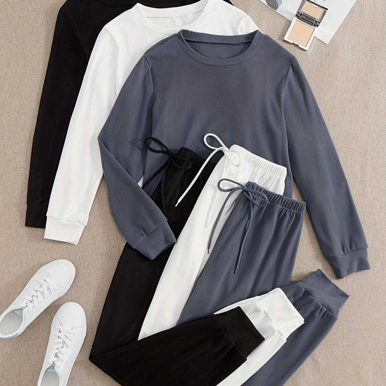 Women's 3-piece lounge set with long sleeve top and jogger pants for a comfortable and relaxed fit in fall.