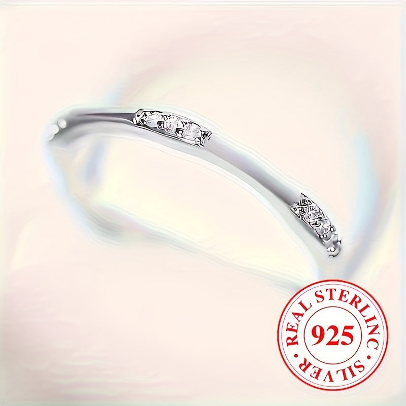 A sleek ring using only 1 gram of 925 sterling silver, embellished with shimmering zirconia, ideal for everyday wear or special occasions such as weddings.