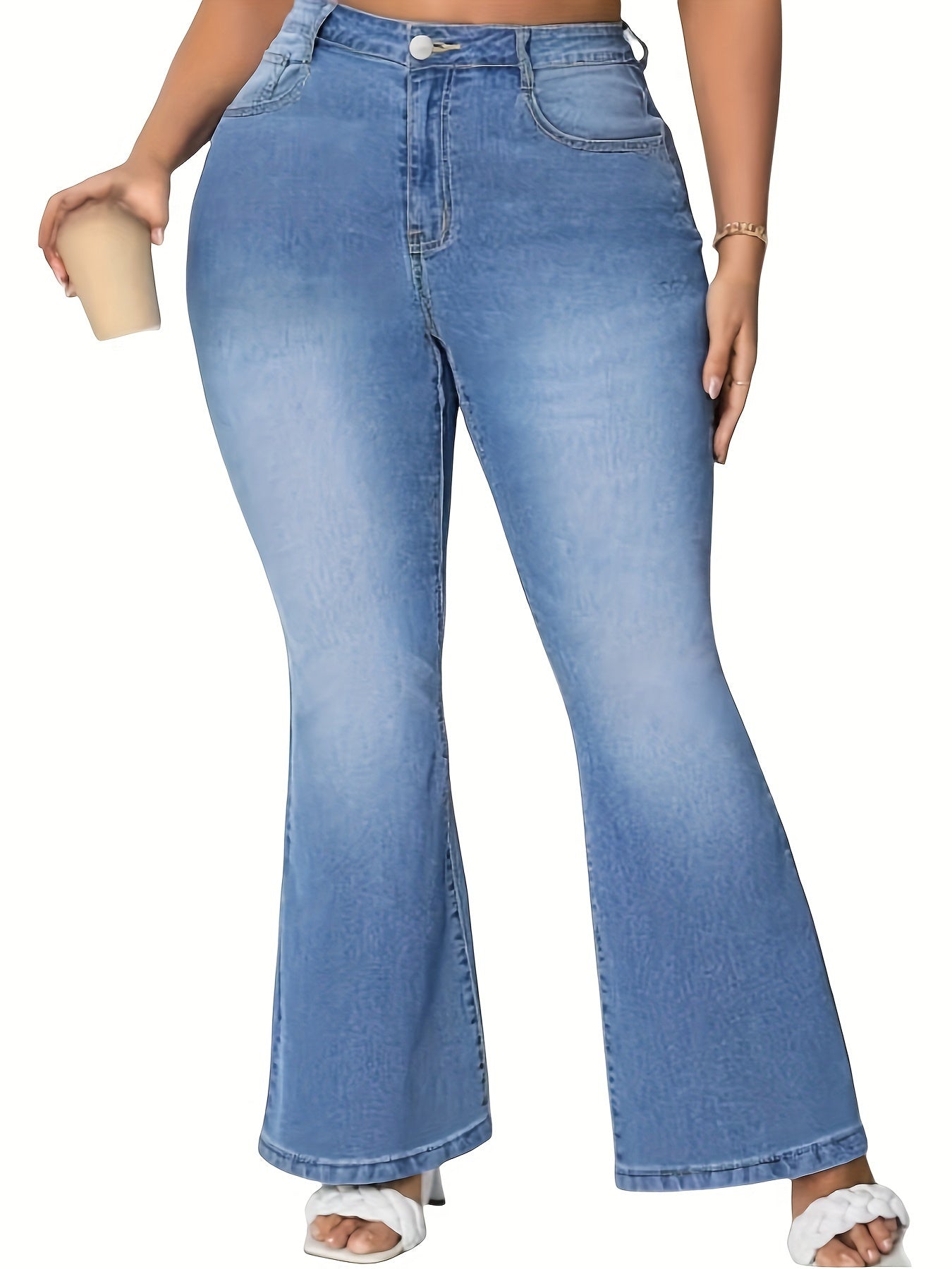 Women's plus size blue flare jeans made of stretch denim with a classic button closure, perfect for casual wear.