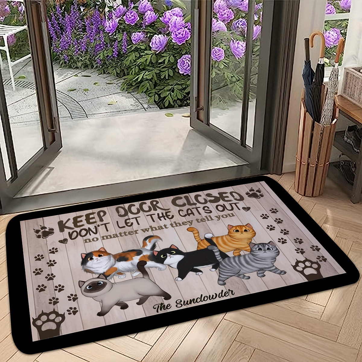 Welcome your guests with this whimsical cat-themed welcome mat featuring cute cartoon cats and paw prints. Made of non-slip, machine washable polyester, this door mat is perfect for both indoor and outdoor use. The black mat is complemented by a wooden