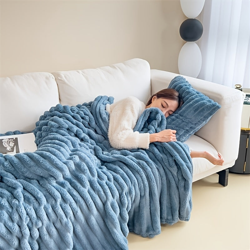 Soft, warm, and luxurious, this contemporary double-sided faux rabbit fur throw blanket is perfect for cuddling up on the couch or bed. Made of polyester knit, it is machine washable for easy care. Whether you're at home or on the go, this all-season