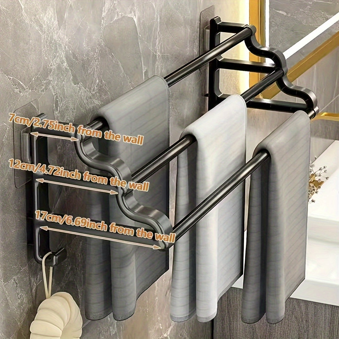 Durable triple bar towel rack with wall mount for organized bathroom storage.