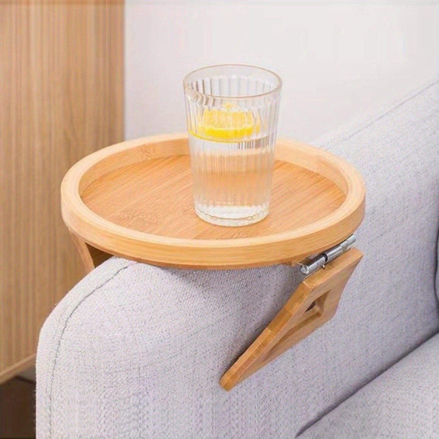 Portable and foldable bamboo armrest tray for sofa, no electricity required. Perfect for use as a side table.