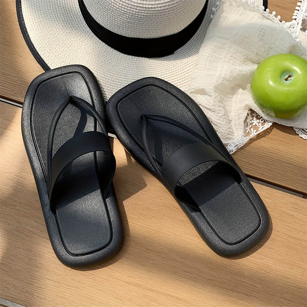 Women's solid color flip flops with soft PVC sole, lightweight and non-slip for casual seaside wear.