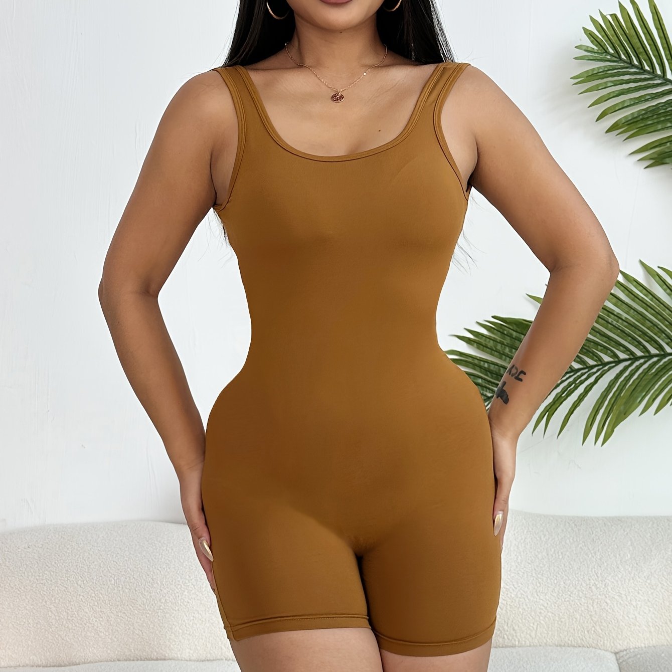 Women's bodysuit shorts made of dacron and spandex knit fabric, feature light support with no padding and polyester lining.