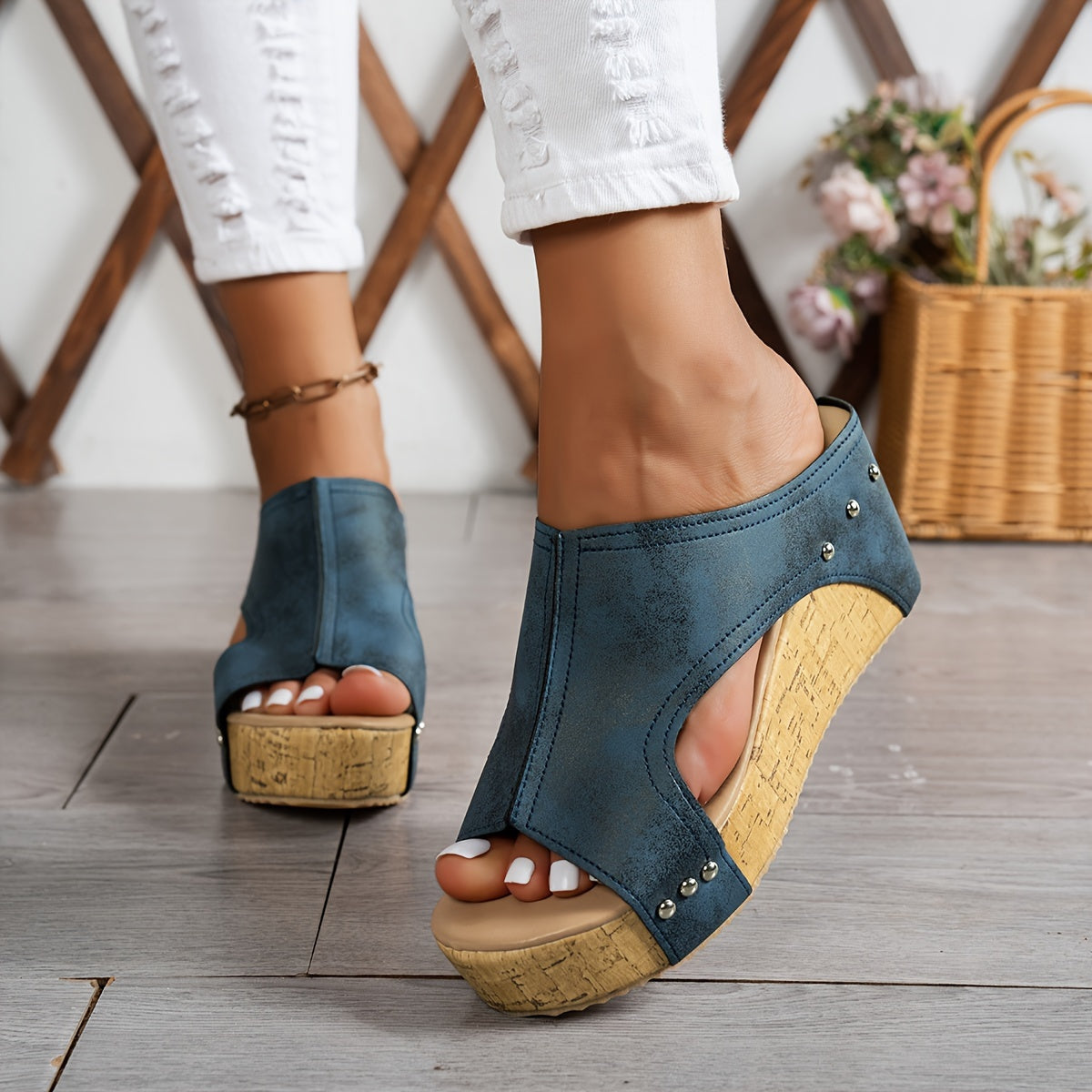 Women's platform sandals with studded decor and wedge heel.