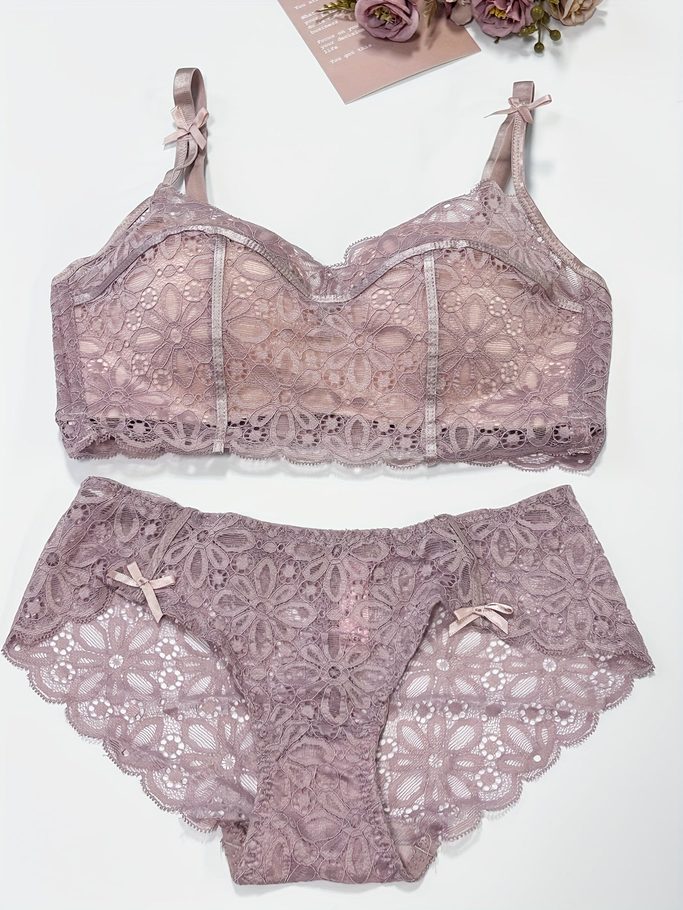 Sexy lace lingerie set for women, with medium support bra and drop waist briefs. Made of polyamide and elastane blend with knit fabric weave. Features solid color with contrast lace details