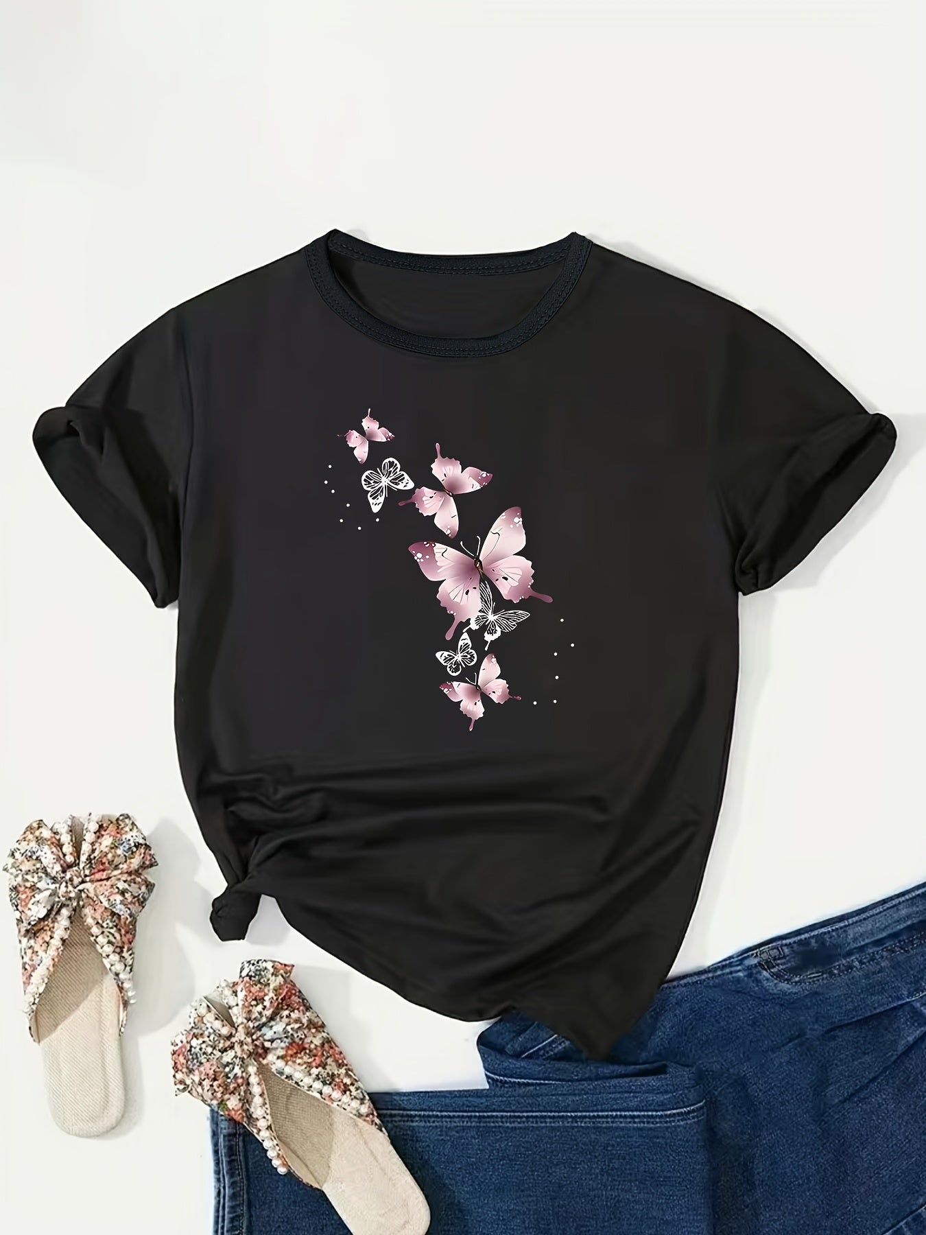 Stylish plus size pink butterfly print t-shirt for women, crew neck, short sleeve, stretchy polyester blend, machine washable. Ideal for spring/summer.