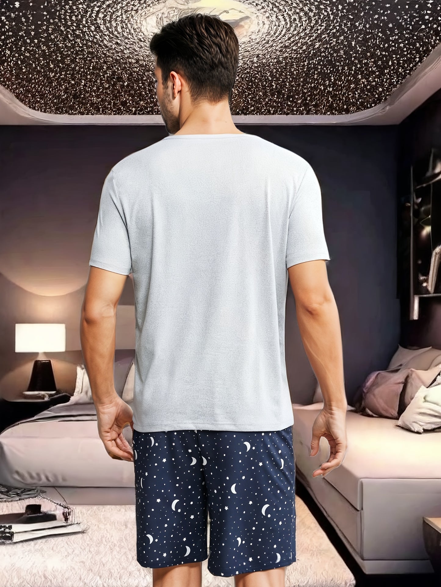 Men's moon and slogan graphic tee and galaxy print shorts pajama set made from polyester with crew neck, medium stretch, random print, regular fit, knit fabric, and elastane composition.