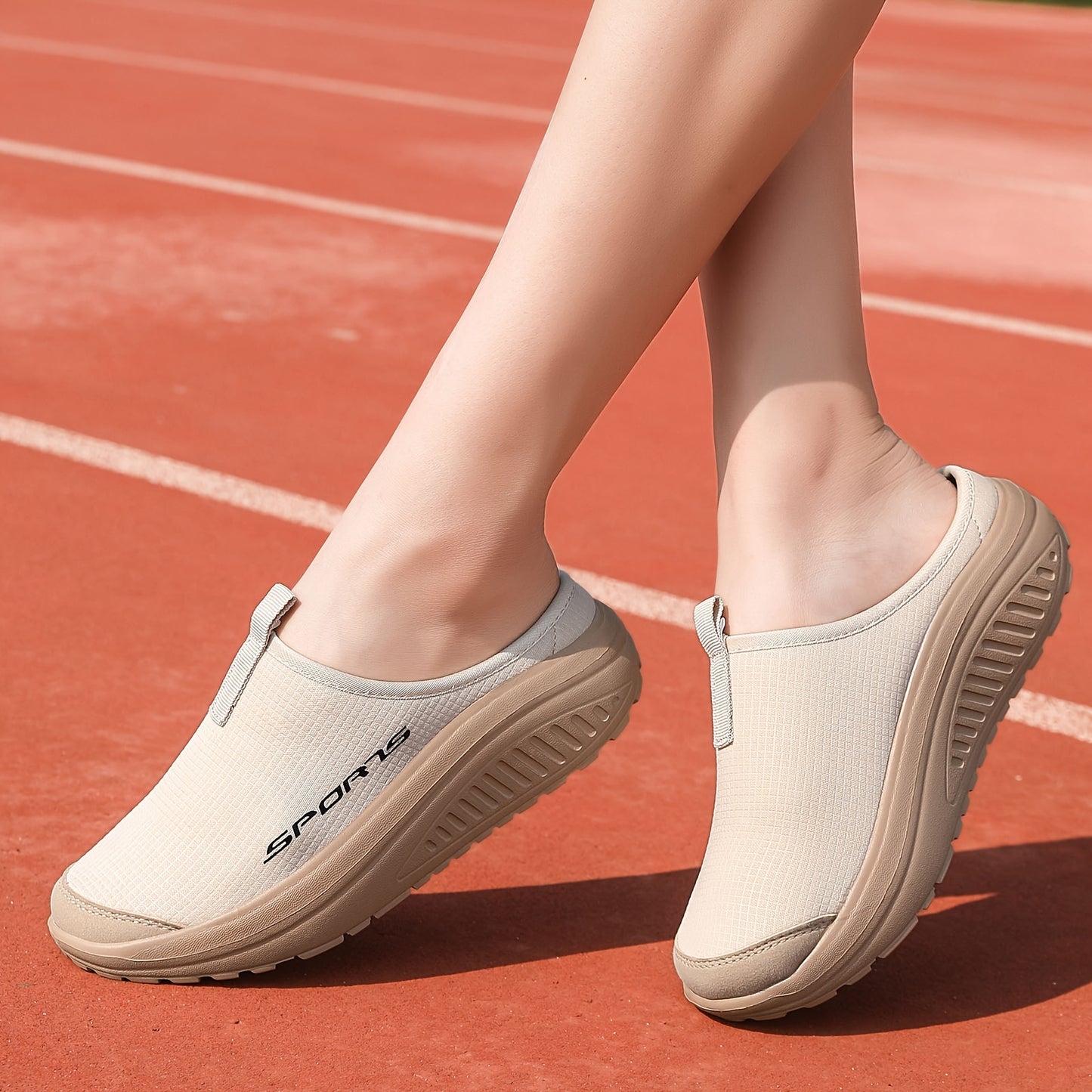 Breathable knit slip-on sneakers with a comfortable EVA rocker sole, beige with sporty logo, suitable for all seasons. Casual low-top design. Durable footwear and shoe accessories.