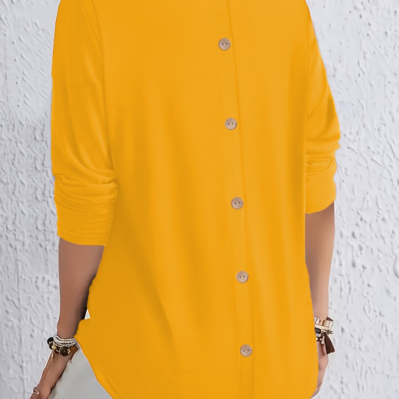 Elegant long-sleeve tops for plus-size women with button detail on the back, perfect for spring and autumn.