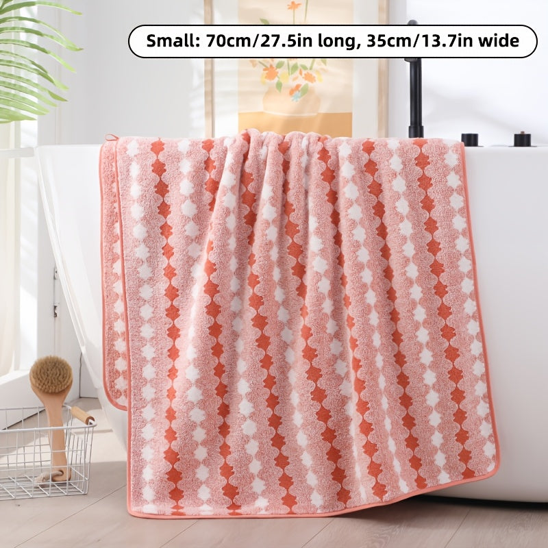 One set of extra large and small bath towels for women made of super soft, absorbent coral velvet with a modern design and strong absorbency.