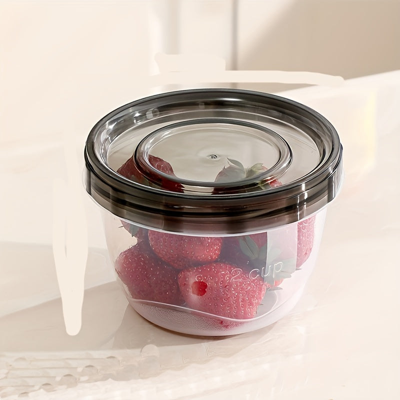 Two pieces of transparent food storage containers with blue lids - microwave safe and freshness preserving round boxes for storing grains, nuts, fruits, and more - perfect for use in home kitchens.