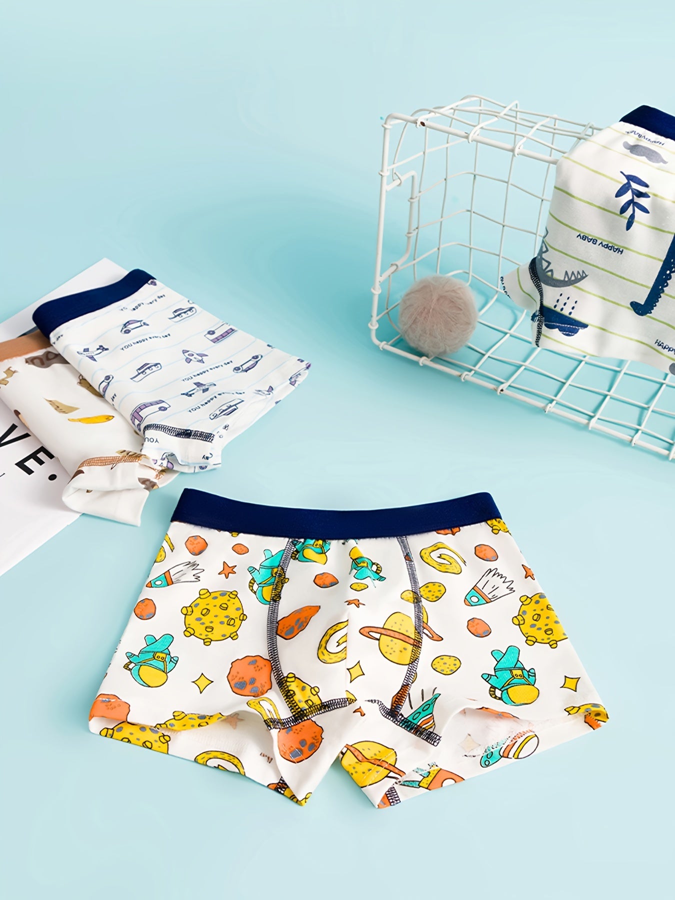 Set of 4 boys' cotton boxer briefs with cute cartoon designs, soft and breathable, ideal for all seasons.