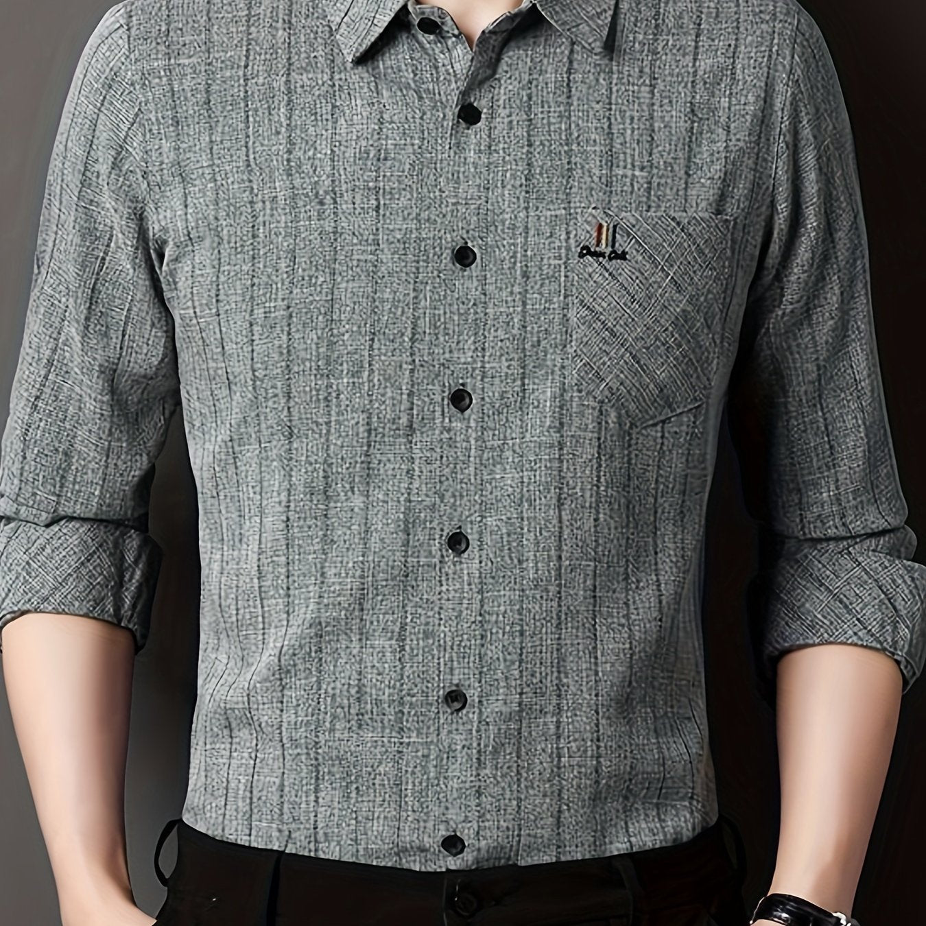 Men's striped shirt with chest pocket, collar, and long sleeves.