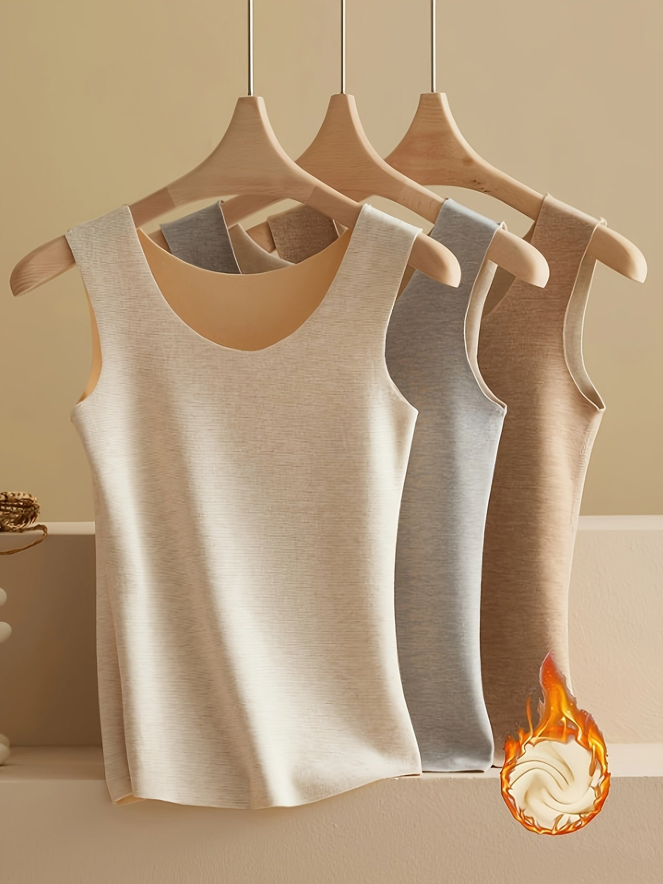 3 pieces of plush-lined thermal underwear with a warm, sleeveless tank top.