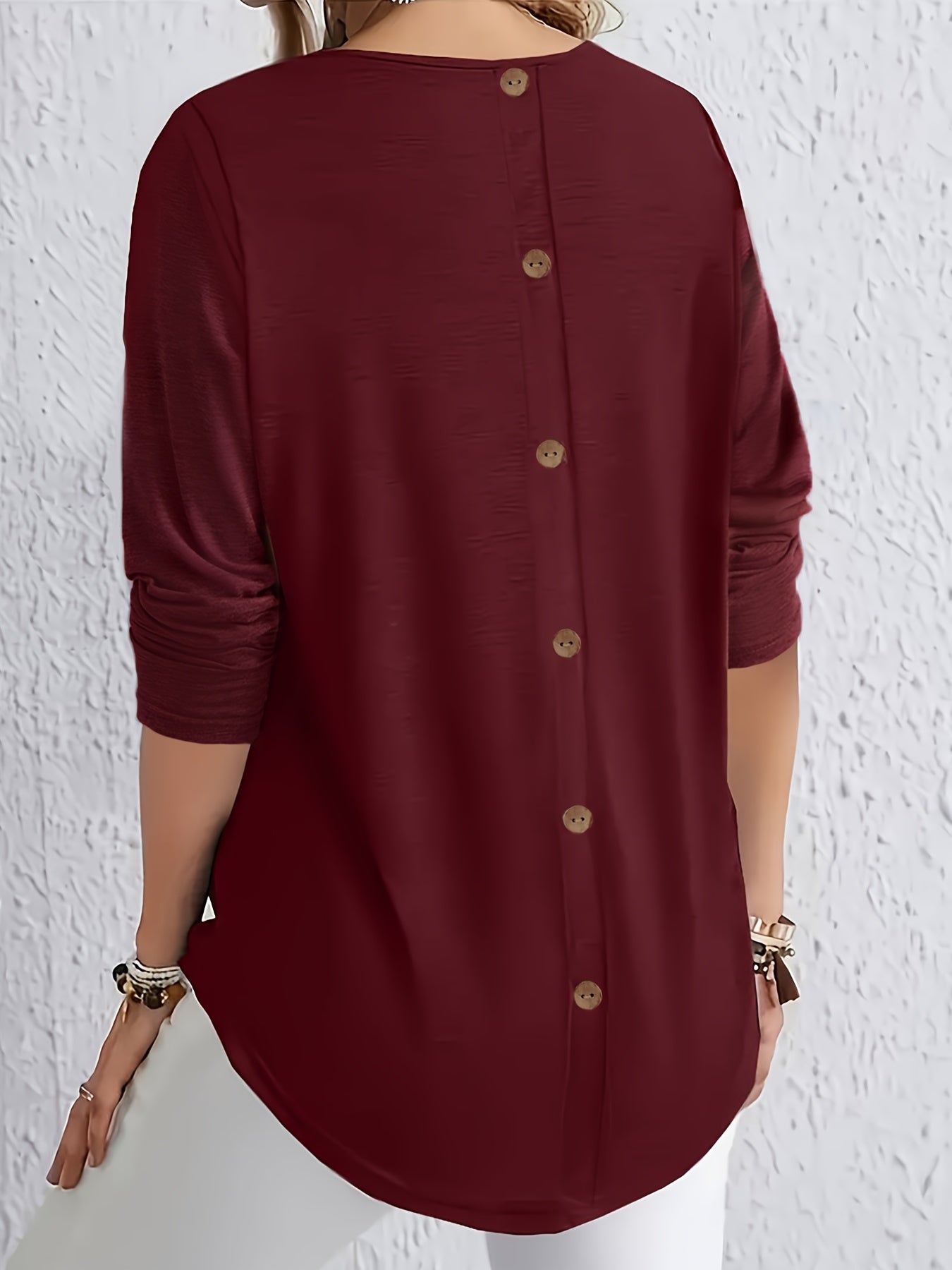 Elegant long-sleeve tops for plus-size women with button detail on the back, perfect for spring and autumn.